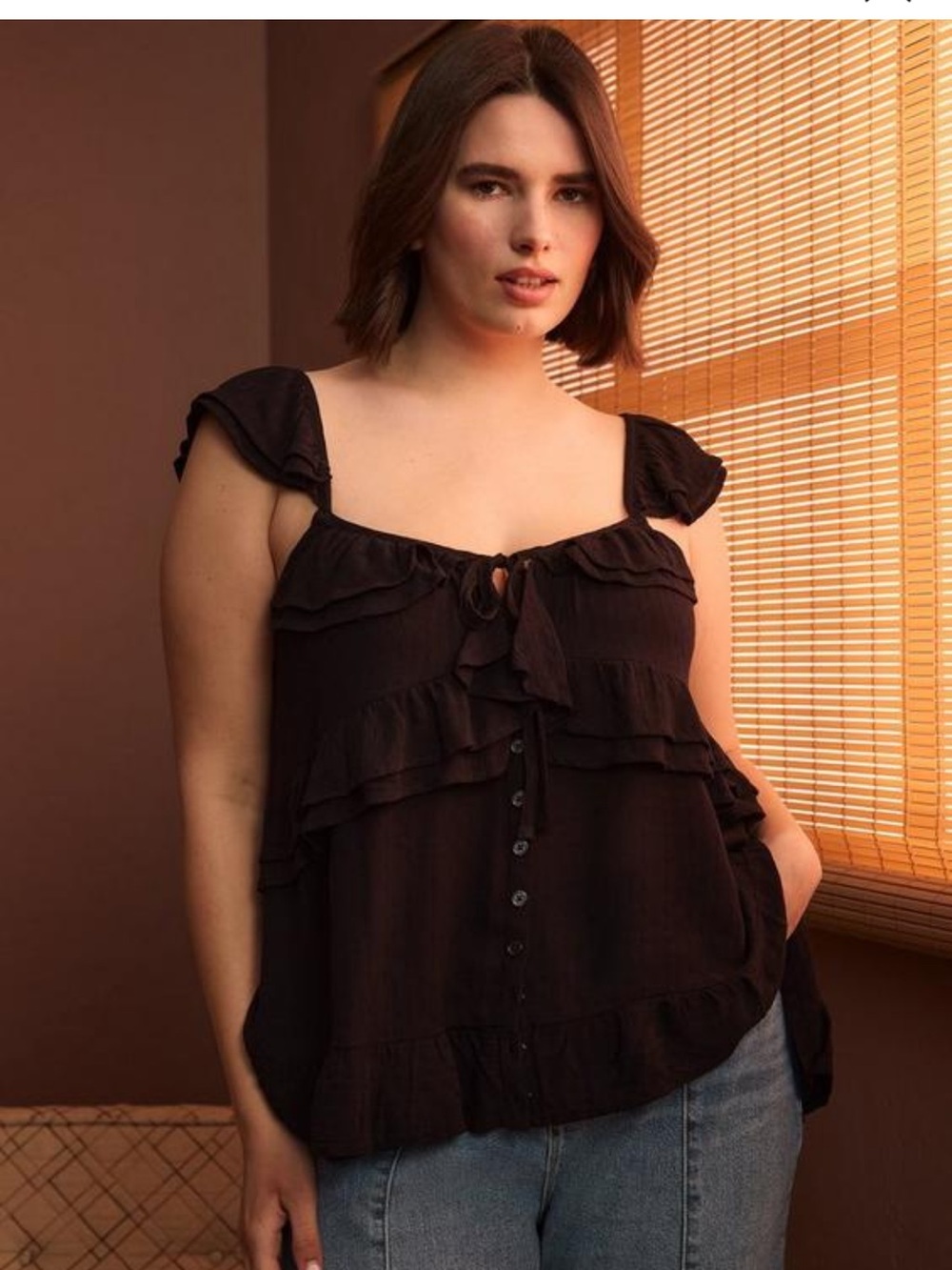 Torrid’s Festi Black Ruffle Tie-Front Sleeveless Tank